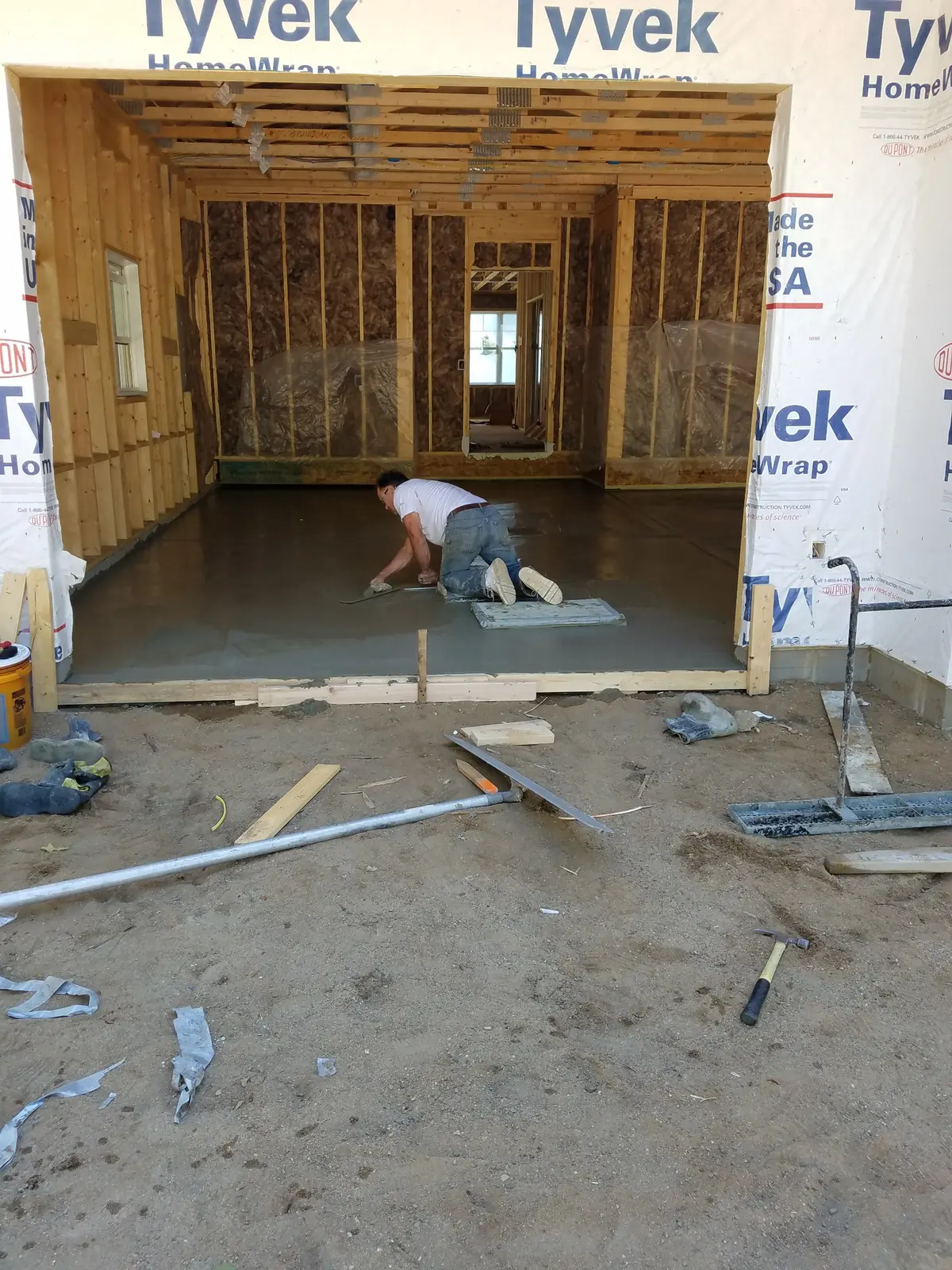 Sam's family concrete crew finishing a residential slab